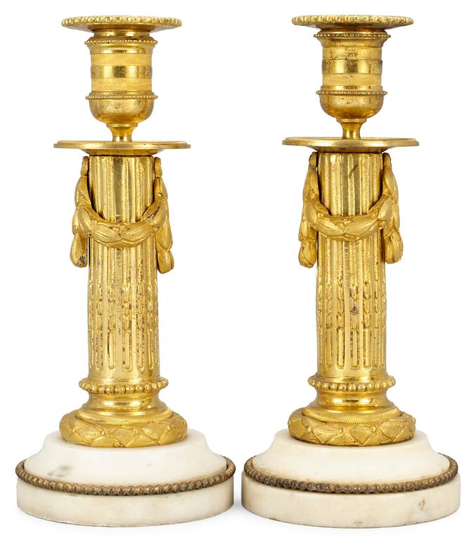 A pair of Louis XVI candlesticks.