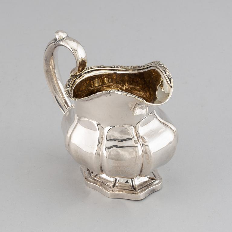 A Russian 19th century parcel-gilt silver cream-jug, mark of Abraham Forstedt, St. Petersburg 1840.