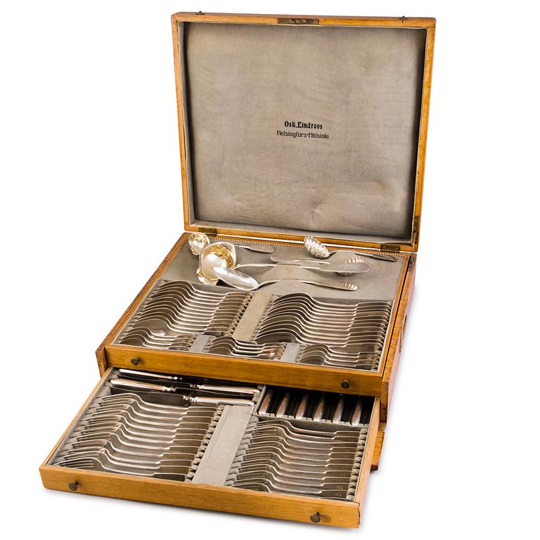 A 89-piece set of 'Helsinki' silver cutlery in wooden case, mark of Oskar Lindroos, Helsinki 1917-1925.