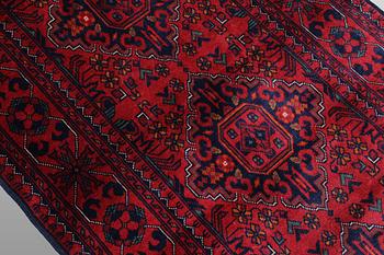 A Afghan runner carpet, 388 x 79 cm.