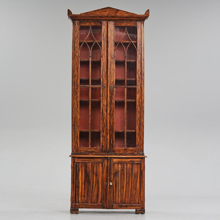 A Swedish faux-boix neo-gothic book cabinet, ca 1830.