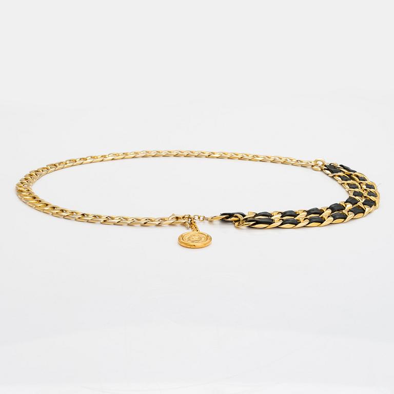 Chanel, a gold coloured metal and leather belt. Marked Coco Chanel Paris.
