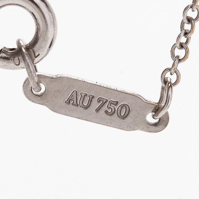 Tiffany & Co, an 18K white gold "Metro Cross" necklace with diamonds.