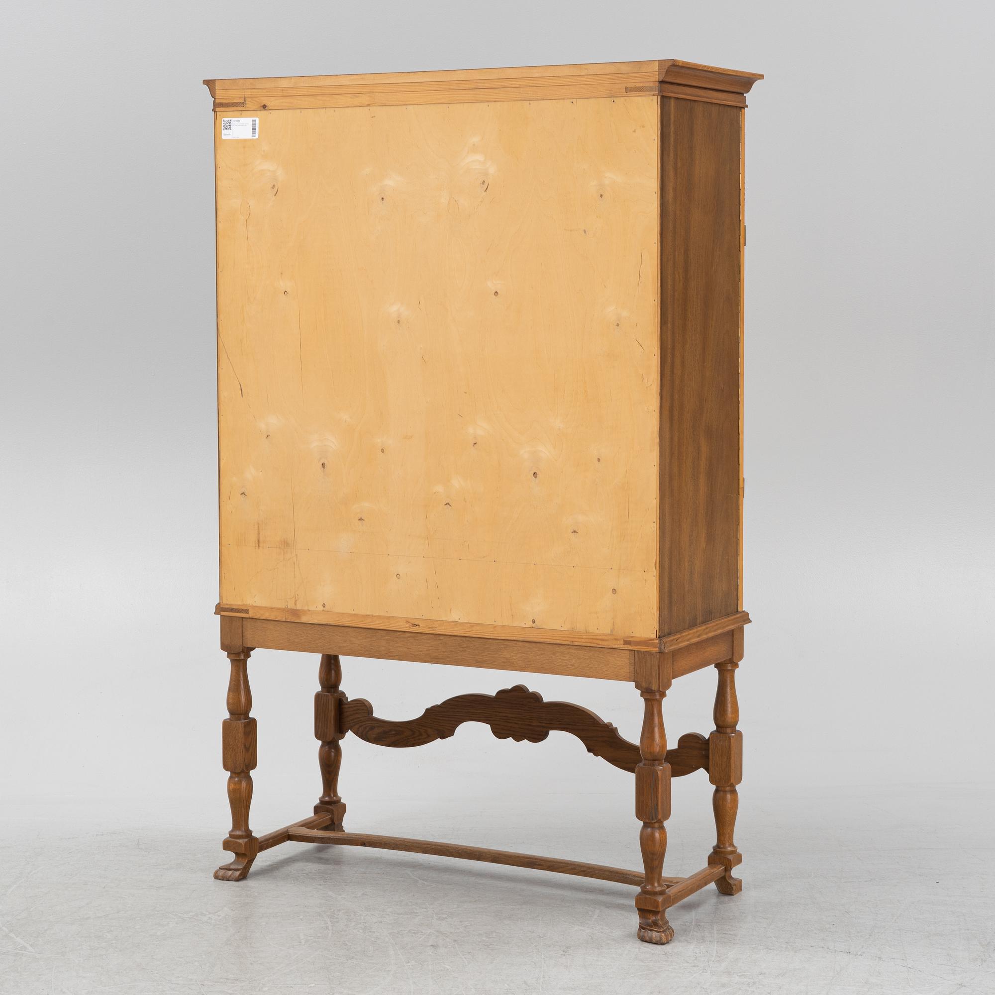 A leather, oak and mahogany cabinet, mid 20th Century.
