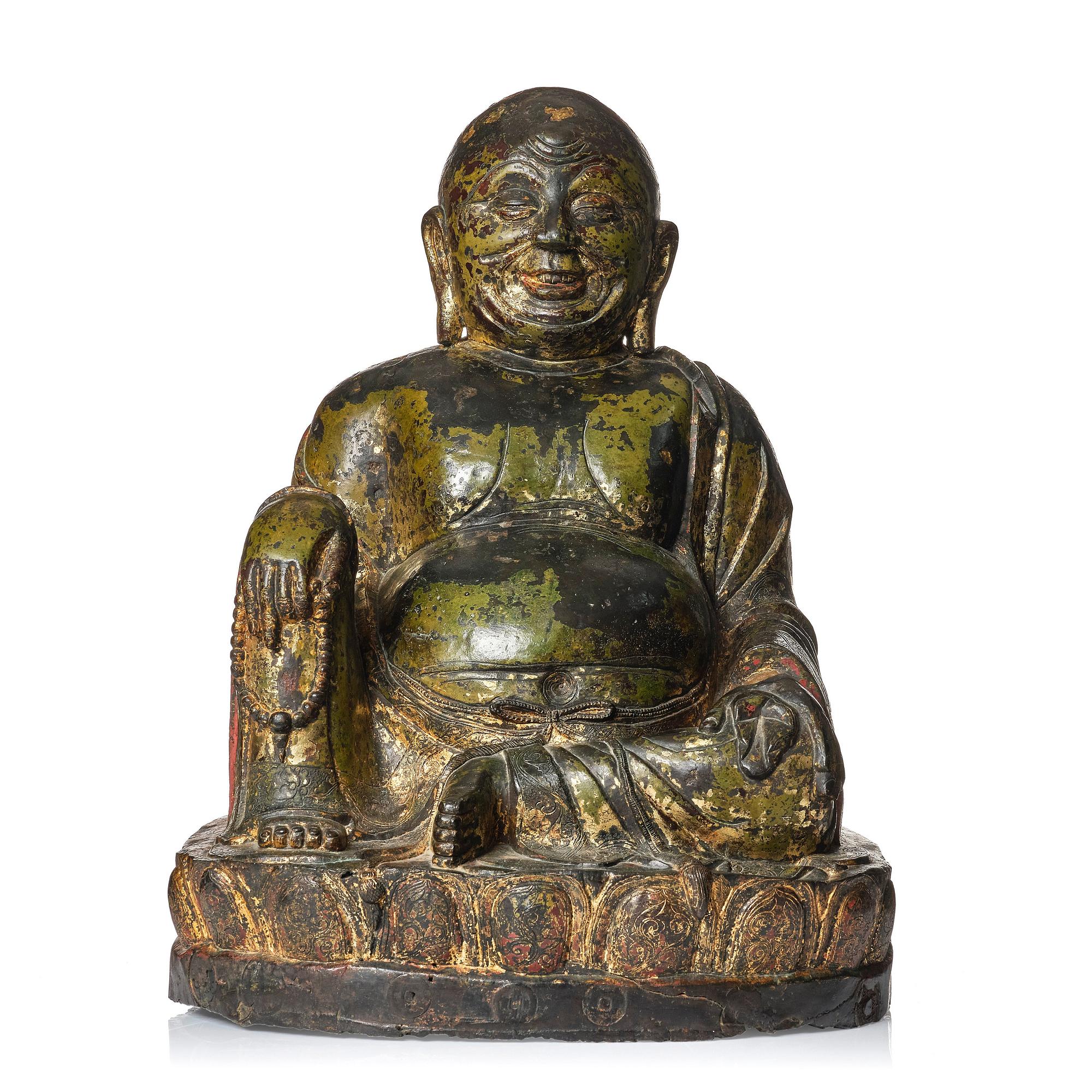A large seated bronze figure of Budai, Ming Dynasty, dated to the fifth year of Jiajing (1526).