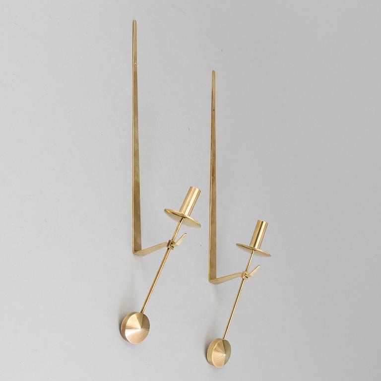 A pair of 20th century brass wall candleholders "Pendel" design Pierre Forssell for Skltuna, Sweden.