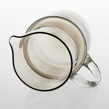 SAARA HOPEA, A glass pitcher and six glasses in rattan basket, for Nuutajärvi. Designed year 1952.