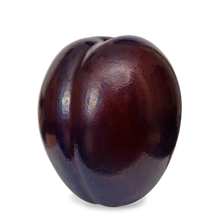 A Hans Hedberg faience sculpture of a plum, Biot, France.