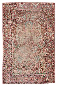 A RUG, a semi-antique Kerman Laver, ca 203 x 130,5 cm.