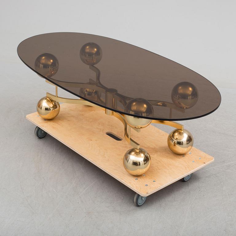 A French 1970s brass and glass coffie table.