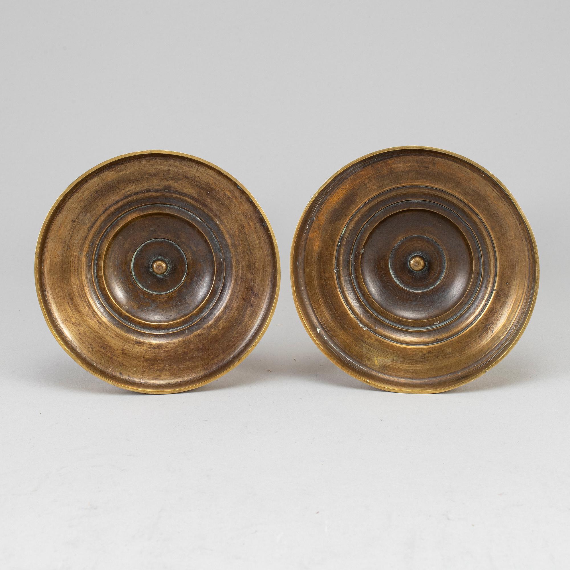 A pair of ormolu candlesticks, first half of the 19th century.