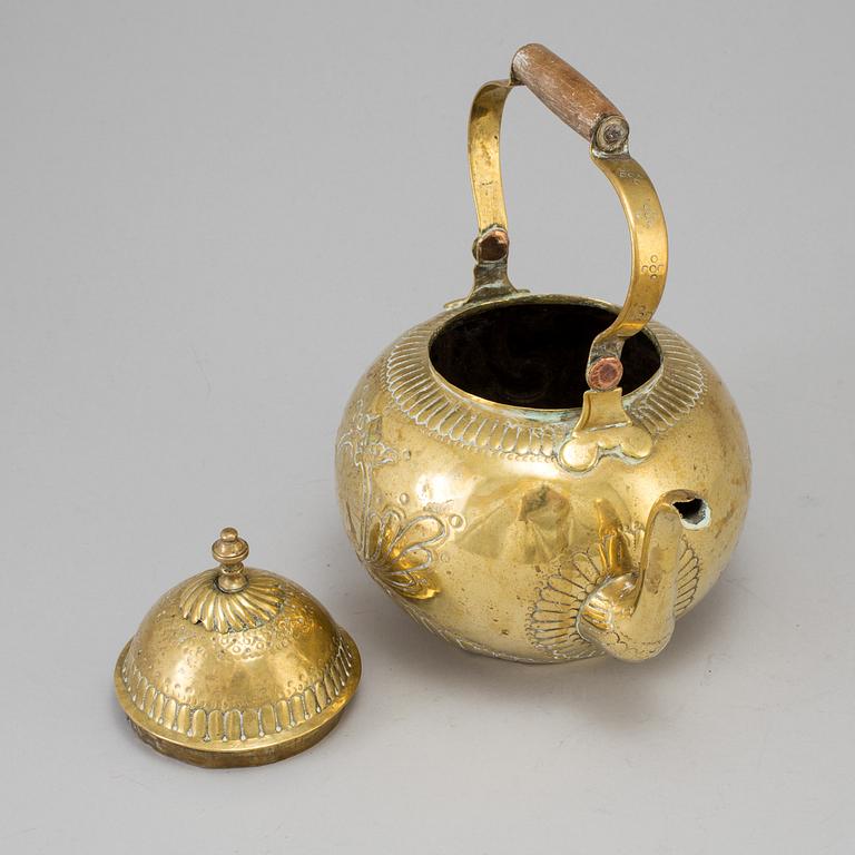 A 18th century brass tea pot.