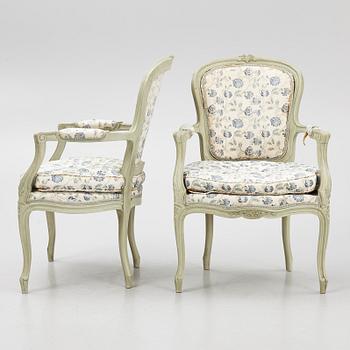 A pair of rococo-style open armchairs, 20th century.