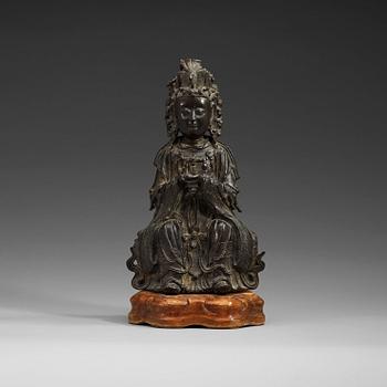 1297. A seated bronze figure of Xi Wangmu, Ming dynasty, 17th Century.