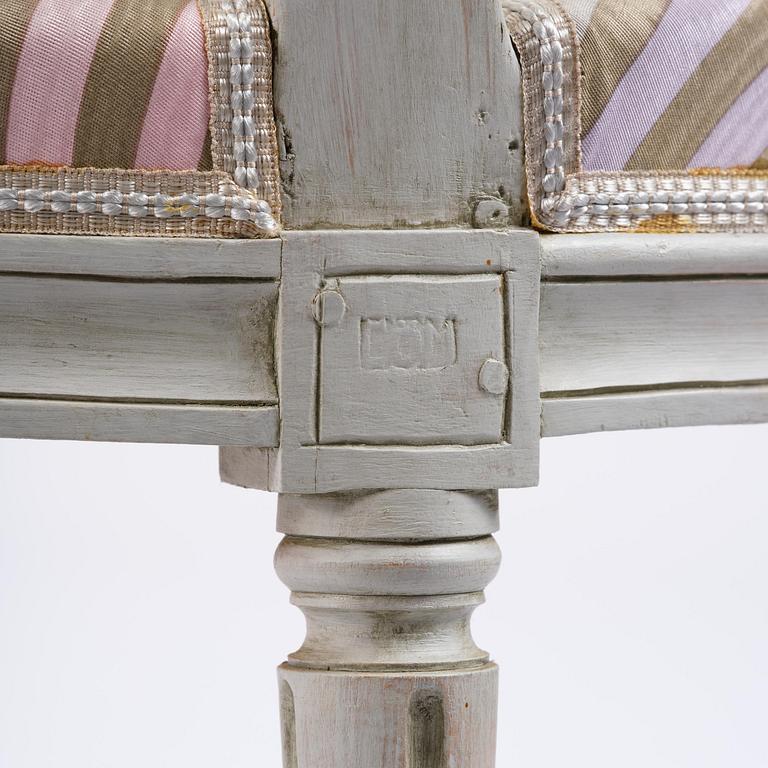 A pair of Gustavian open armchairs by E. Öhrmark (master in Stockholm 1777-1813).