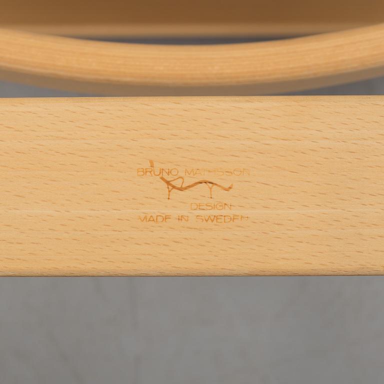 An "Mina" armchair by Bruno Matsson.