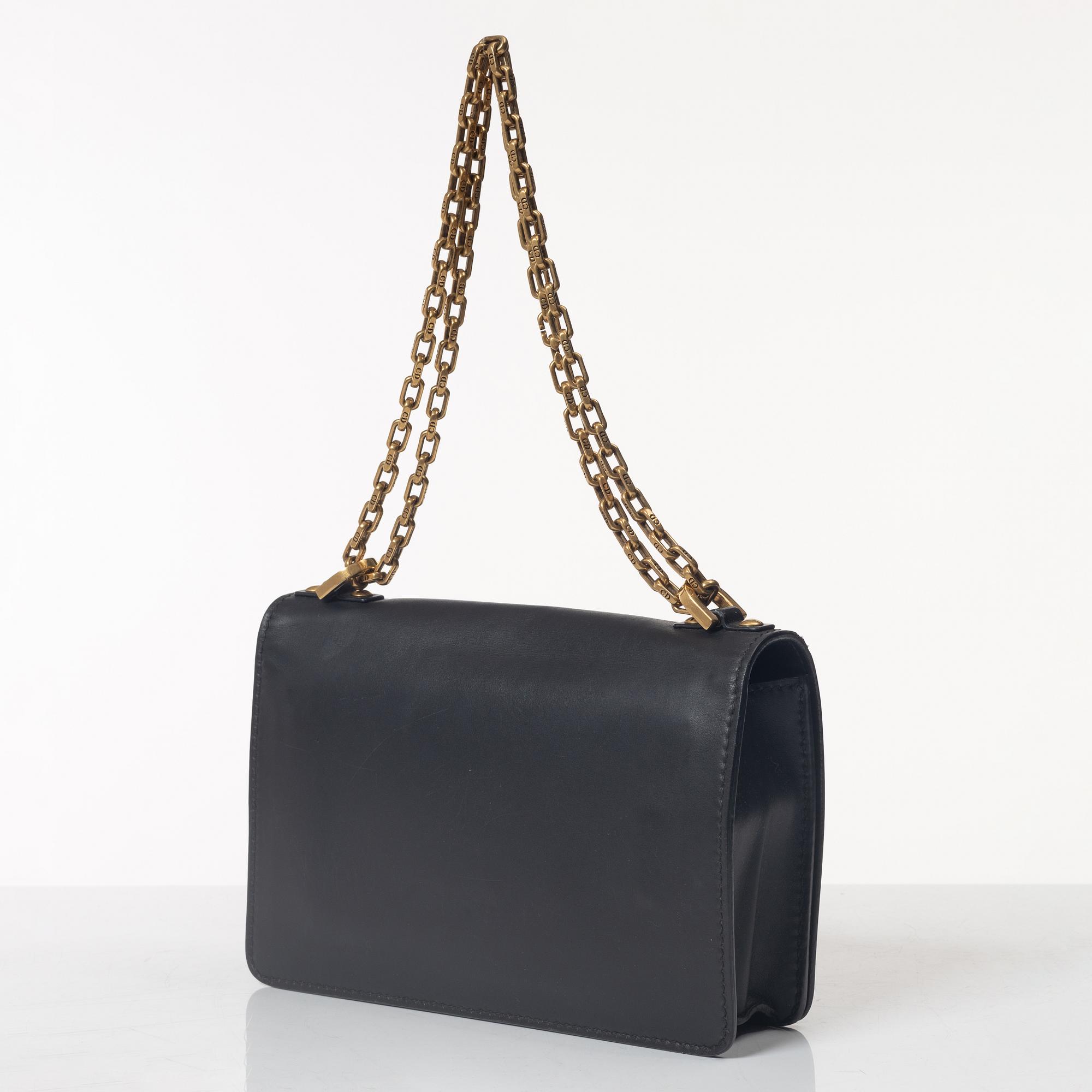 Christian Dior, A black leather "Dio(r)evolution" bag.