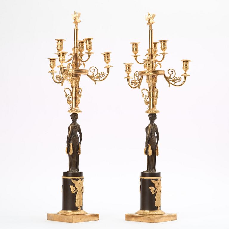 A pair of Empire early 19th century six-light candelabra.