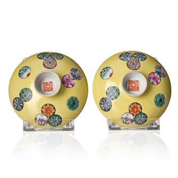 A pair of yellow glazed covers, late Qing dynasty, with Qianlong mark.
