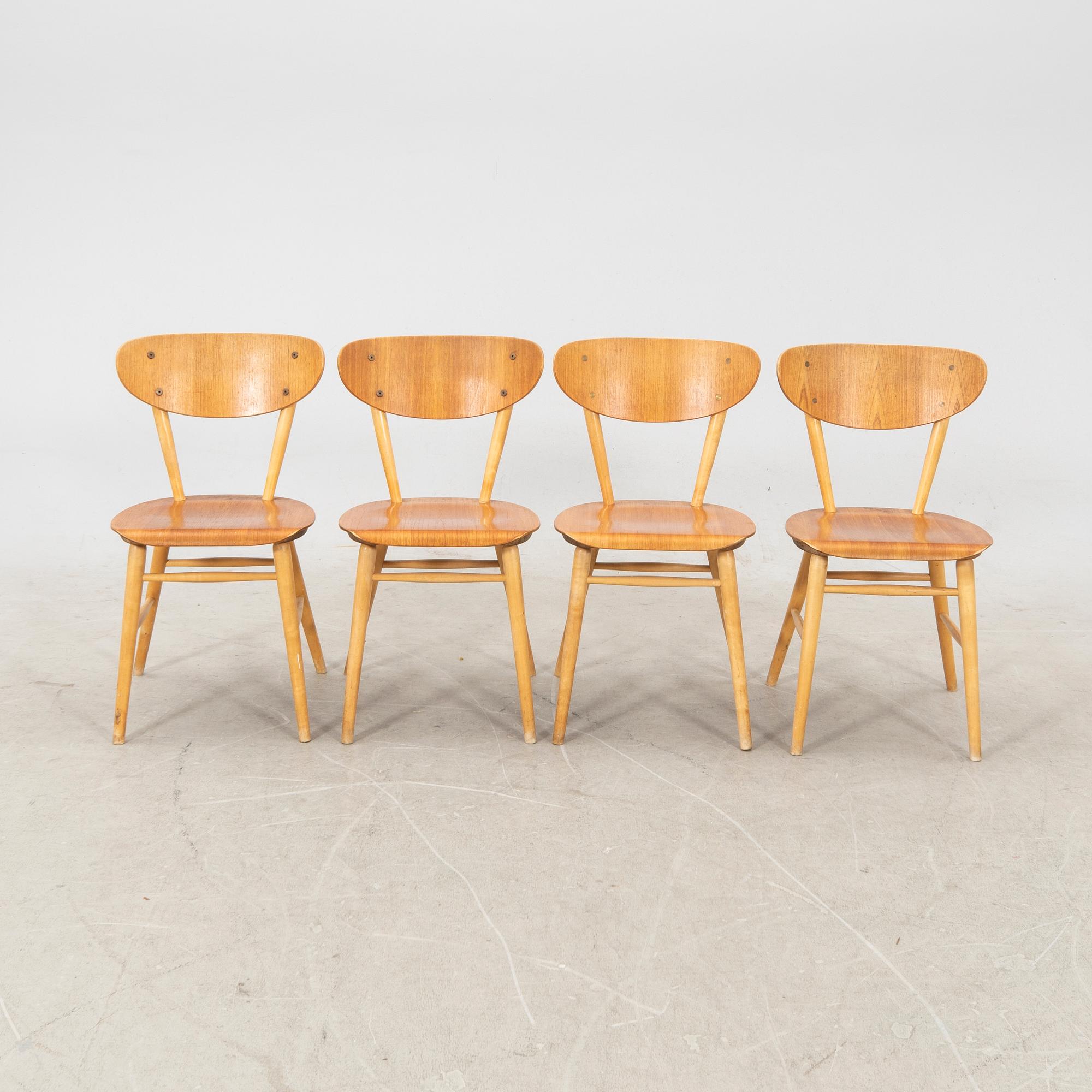 A set of four birch and teak veneered chairs from Bröderna Wigells stolfabrik, Malmbäck mid 20th century.
