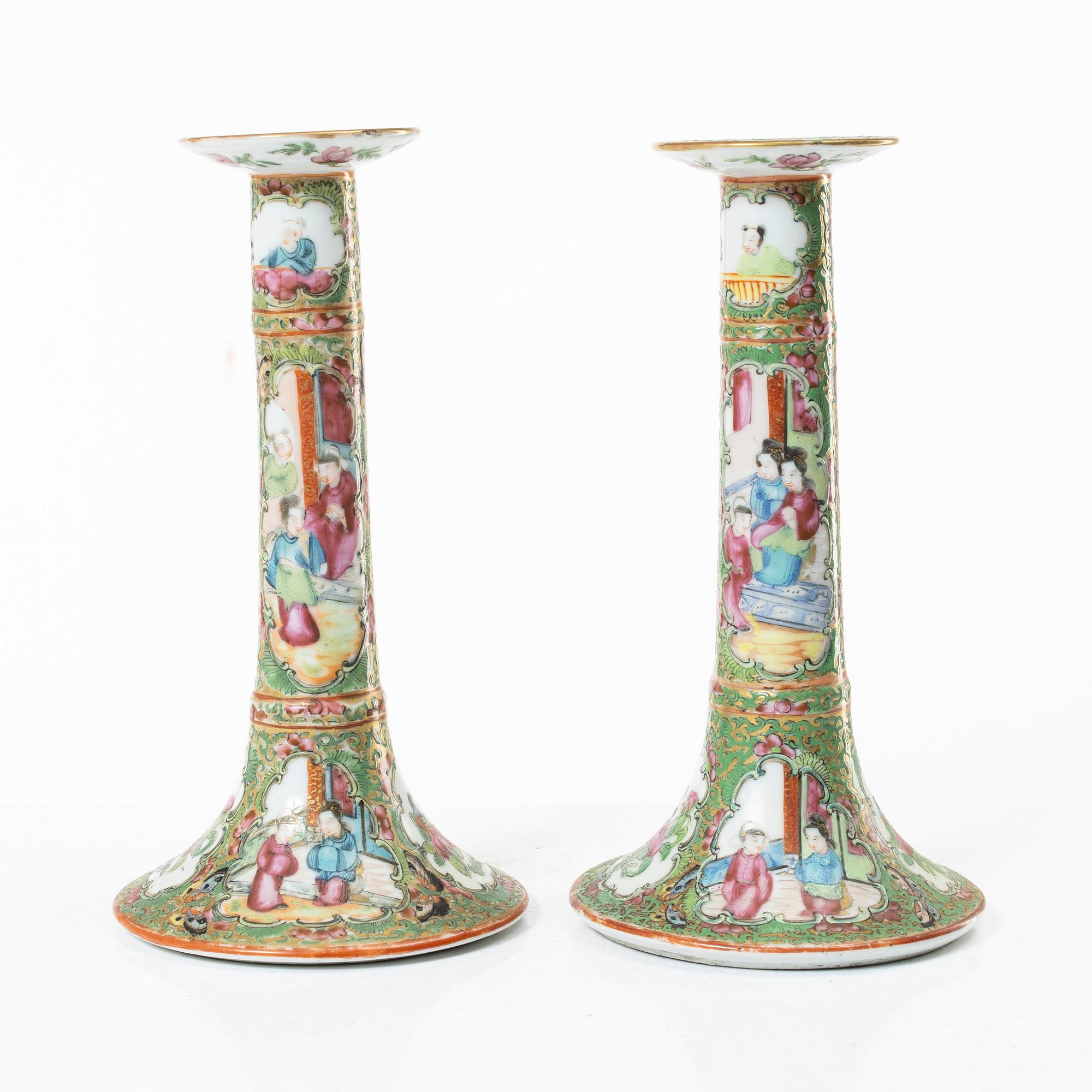 A pair of famille rose Canton candle sticks, Qing dynasty, 19th century.