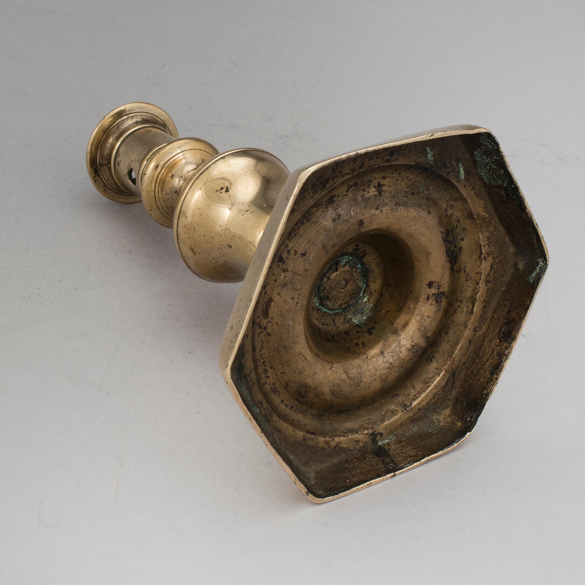 A BRONZE BAROQUE CANDLESTICK, 17th century.