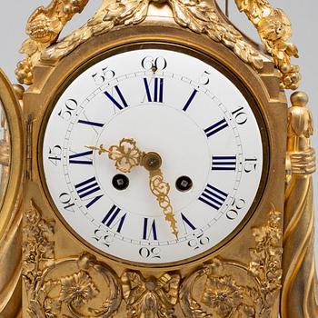 A FRENCH BRONZE MANTEL CLOCK, second half of the 19th century.