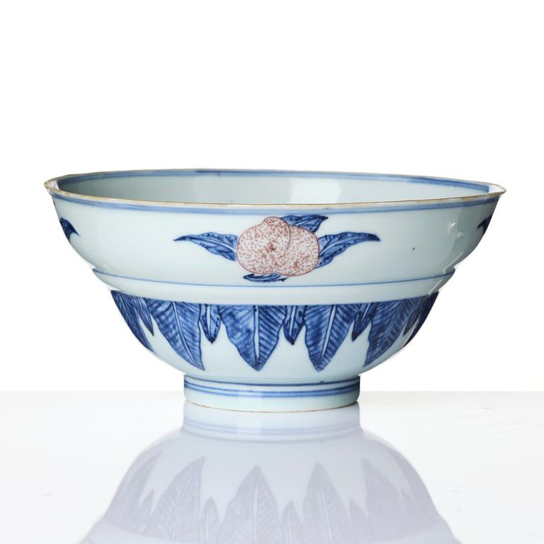A blue and white and copper-red 'peaches' bowl, Qing dynasty.