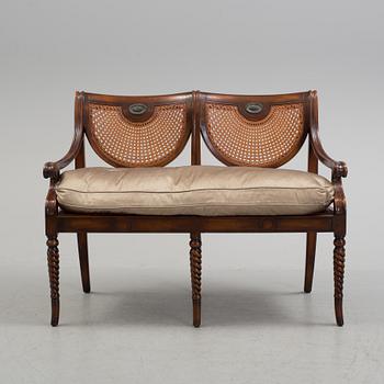 A modern made "Regency refinement" sofa.