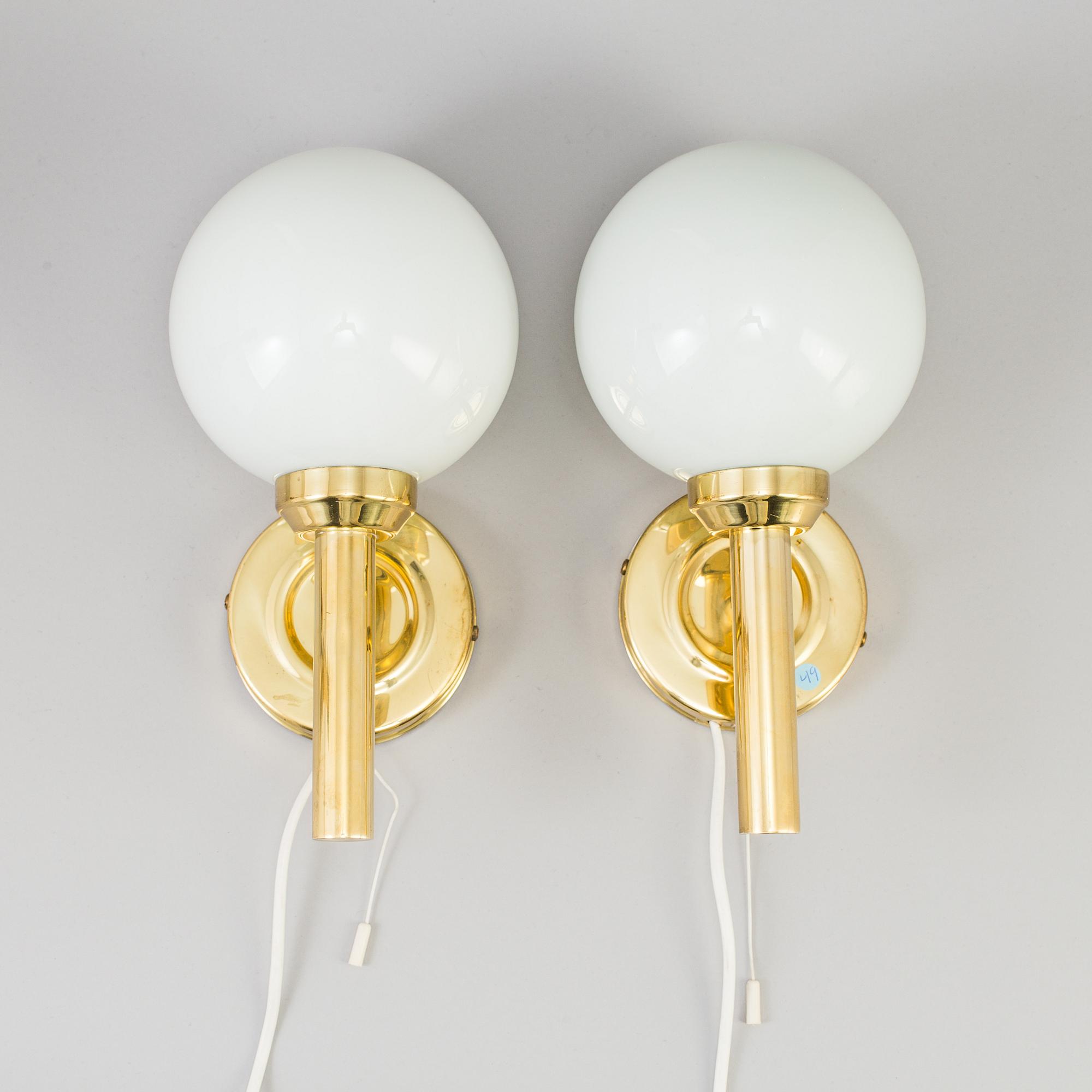 A pair of 20th century brass wall lights by Abo Denmark.