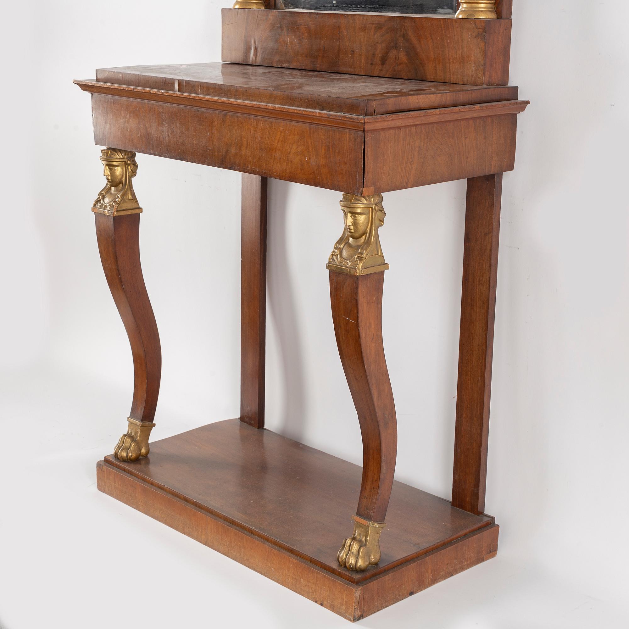 A Swedish Empire mirror and console table, first half of the 19th century.