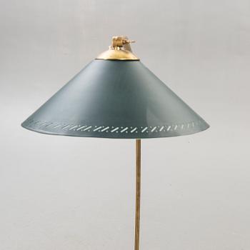 A 1950s brass floor lamp.