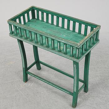 A painted plant stand, circa 1900.