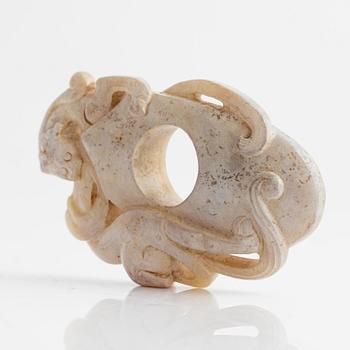 An archaistically carved nephrite sculpture, China, 20th Century.