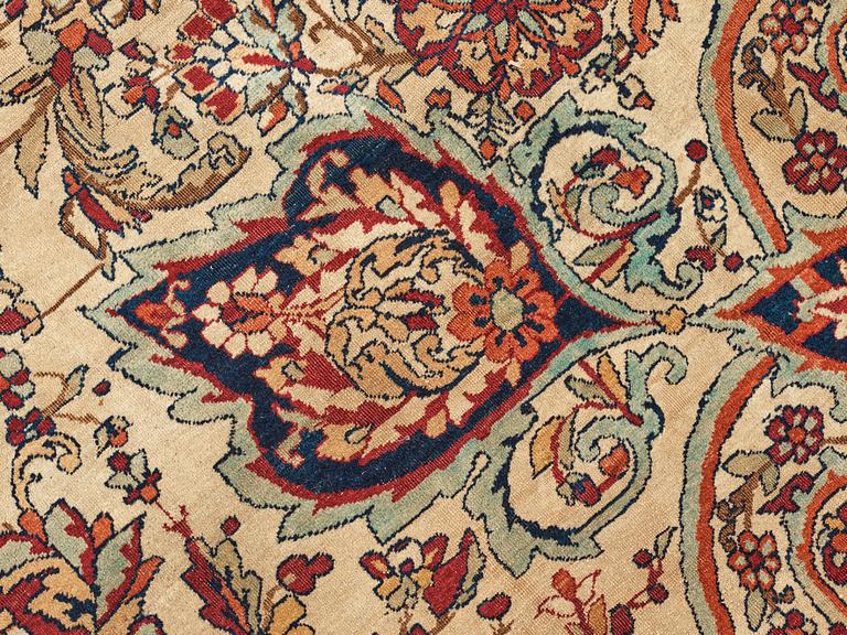 A carpet, an antique Kerman Laver, ca 677-688,5 x 510,5-526 cm.
