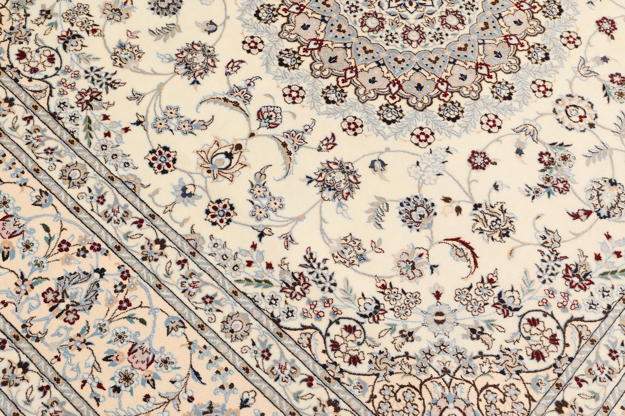 A Nain part silk carpet, c. 207 x 208 cm.