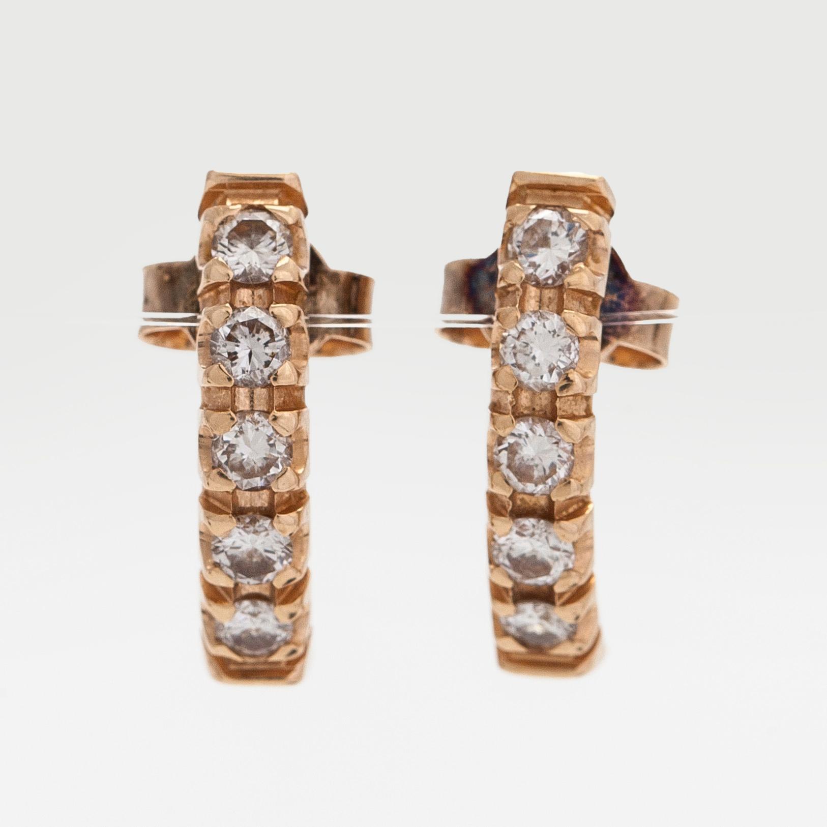 Korvakorut, 14K kultaa ja briljanttihiottuja timantteja.
