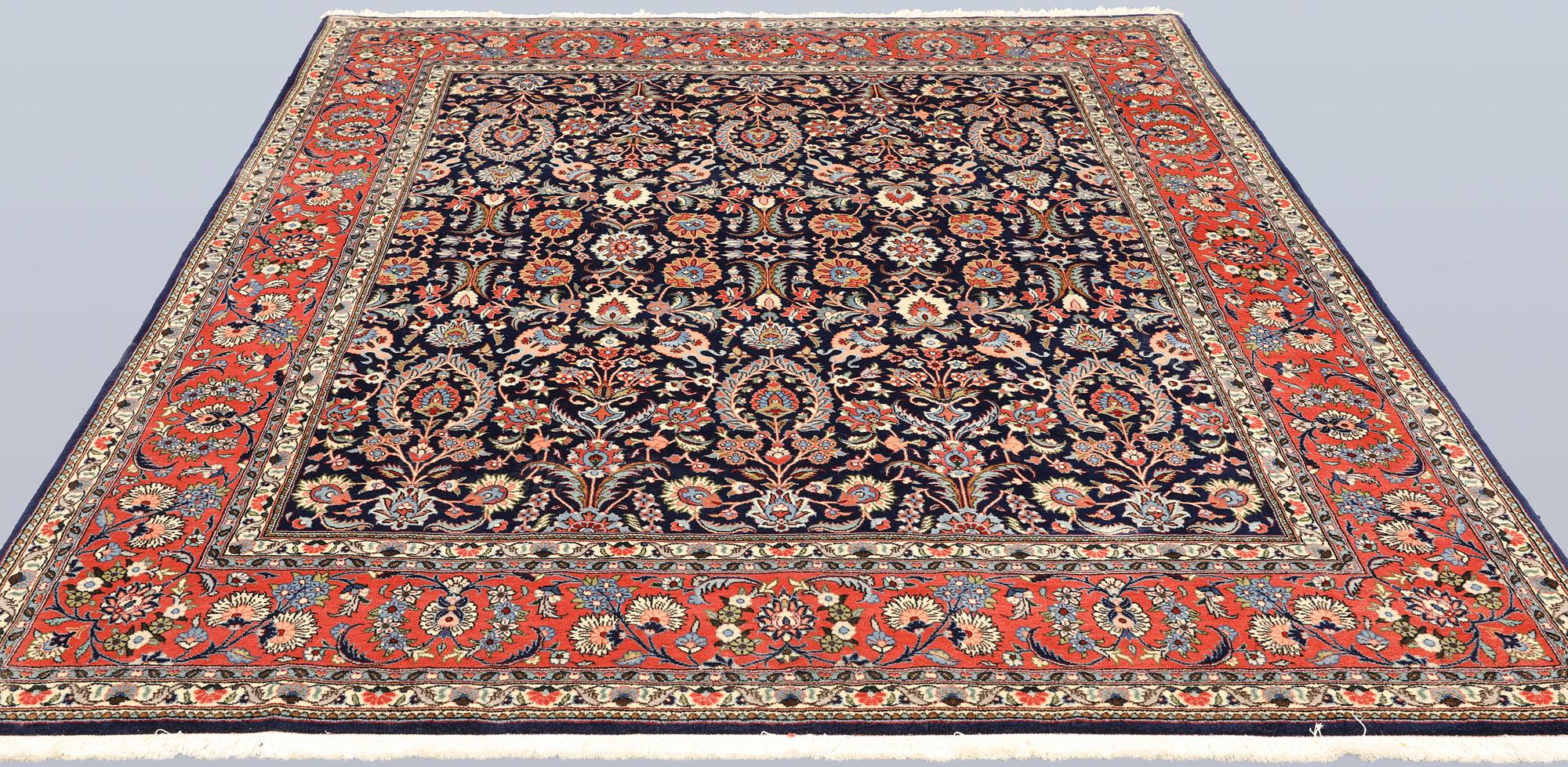 A part silk Sarouk rug, signed, approx. 240 x 208 cm.