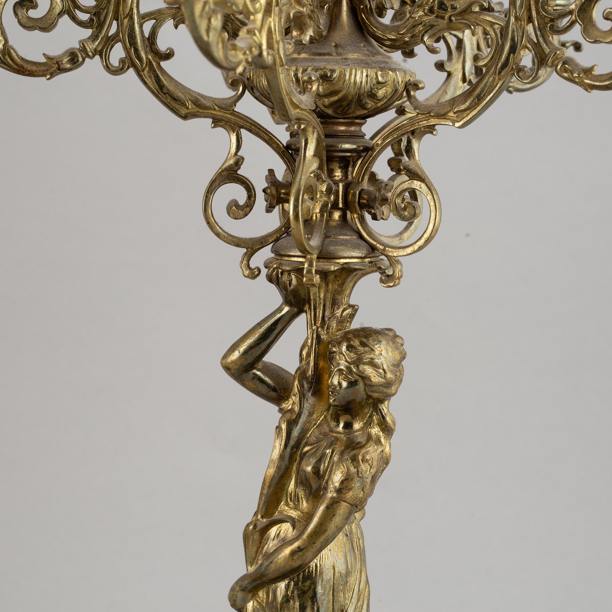 A pair of late 19th century brass candelabra for six candles.