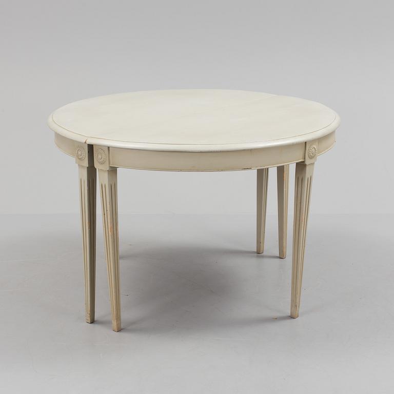 A lot of four mid 20th century Swedish Gustavian style chairs and one dinner table from around year 1900.