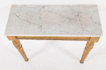 A Swedish Gustavian style mirror and console table with marble top from the first half of the 20th century.