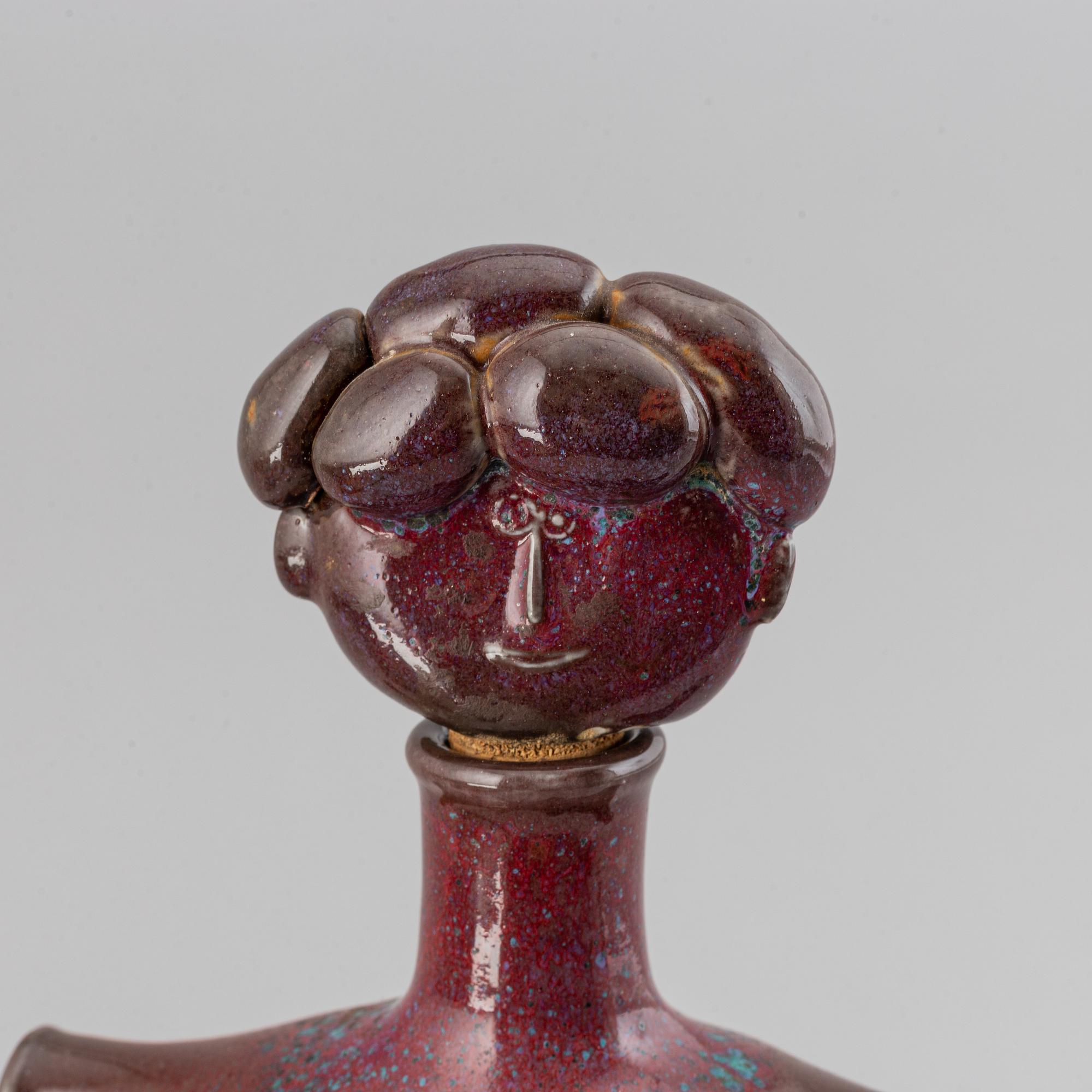 Stig Lindberg, a parian figurine and a stoneware flask with cover, Gustavsberg.