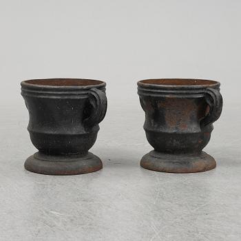 A 19th  century pair of cast iron flower pots.