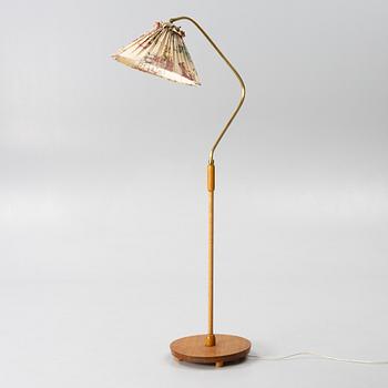A 1940s Swedish Modern floor lamp.