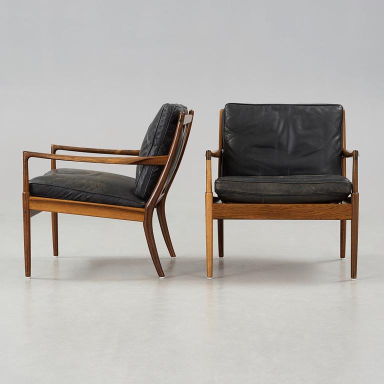 Ib Kofod-Larsen, a pair of palisander and black leather 'Samsö' armchairs, 1960's, for Thysell's, Anderslöv, Sweden.