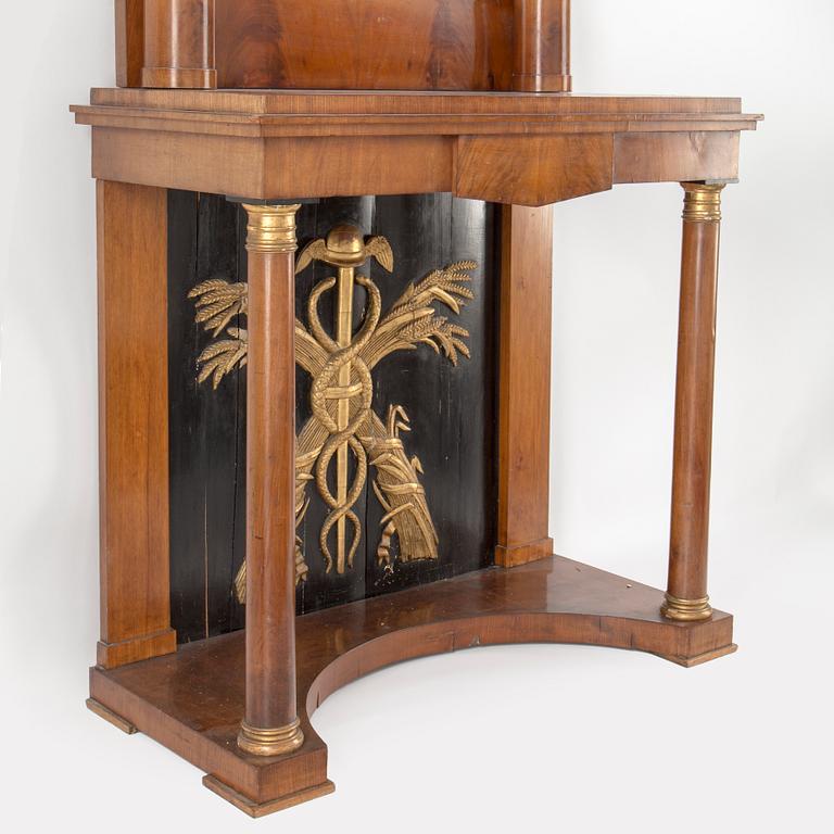 A swedish empire mirror and console table. First half of the 19th century.