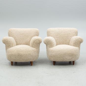 A pair of Swedish Modern easy chairs, mid 20th century.