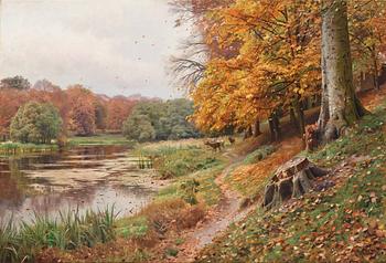 454. Peder Mork Mönsted, Autumn day in the forest, red deer by a lake.