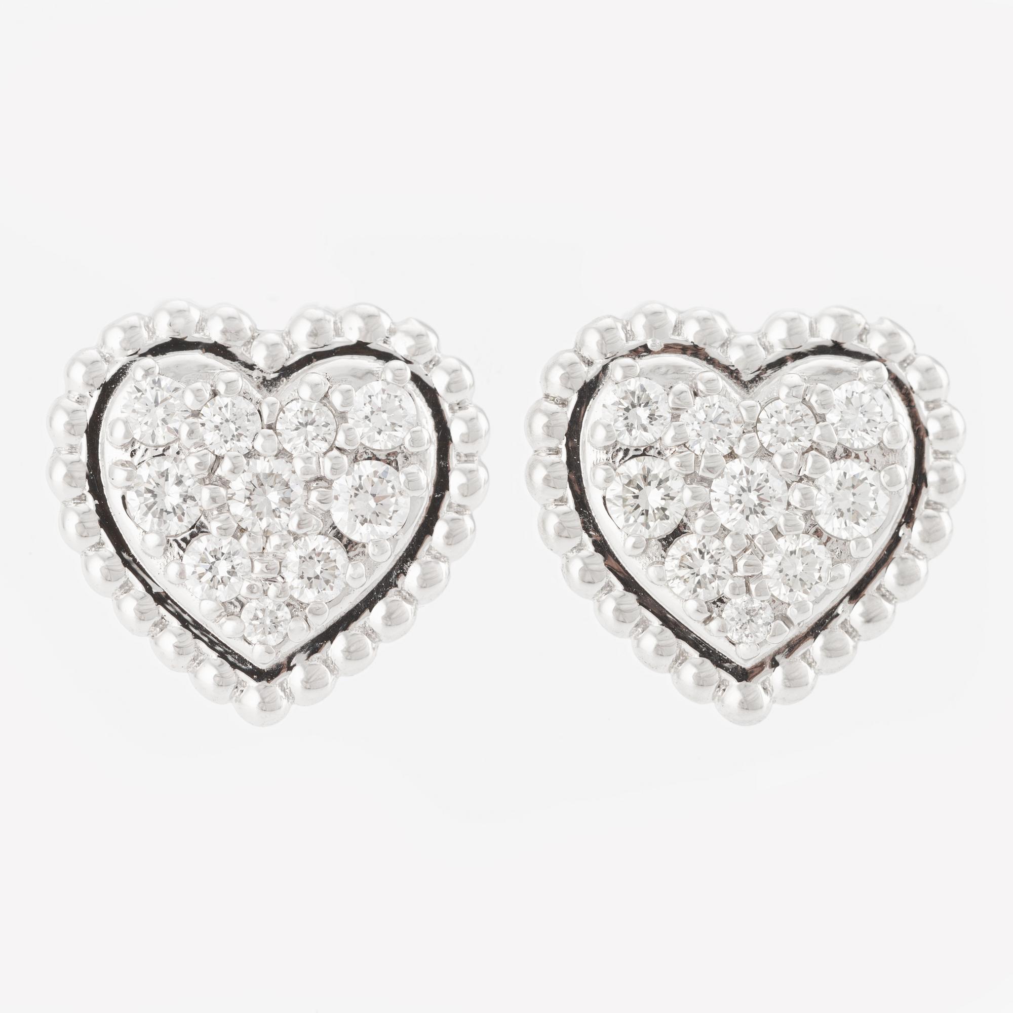 Heart-shaped earrings with brilliant-cut diamonds.