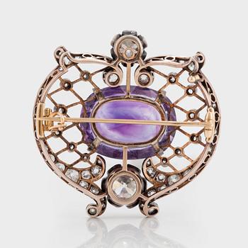 A BROOCH set with an amethyst and old-cut diamonds.